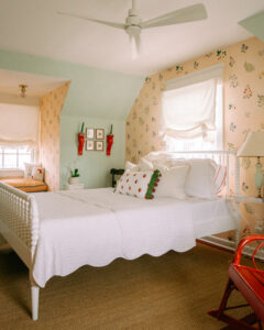 Feminine bedroom featuring pale green, soft yellow and white bedding.